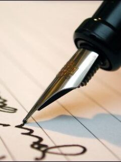 man writing a contract